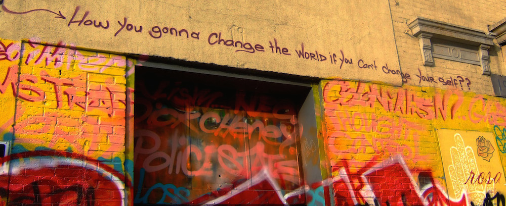 Painted wall with the text How you gonna change the world if you can't change yourself?